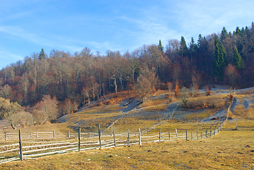 Image showing Late autumn landscape , wood fences on meadow