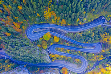 Image showing Curvy road in autumn forest