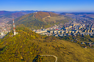 Image showing Aerial view of antenna tower and city in the valley