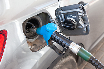 Image showing Pumping gasoline fuel in passenger car at gas station
