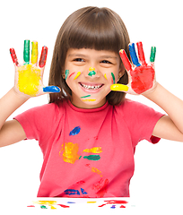 Image showing Portrait of a cute girl playing with paints