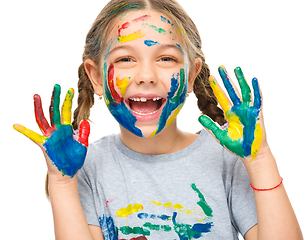 Image showing Portrait of a cute girl playing with paints