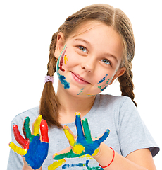 Image showing Portrait of a cute girl playing with paints