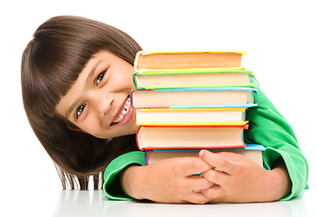 Image showing Little girl with her books