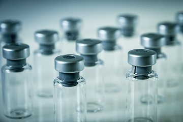 Image showing Vaccine glass bottles on grey background