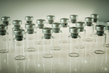 Image showing Vaccine glass bottles on grey background