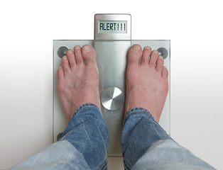 Image showing Man\'s feet on weight scale - Alert