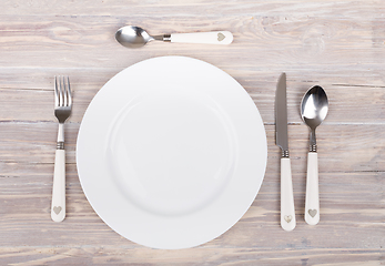 Image showing empty plate with knife and fork