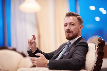 Image showing Portrait of smiling ceo at modern office in stylish suit