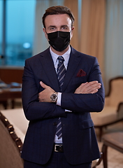 Image showing business man wearing protective face mask at office