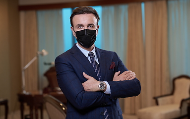 Image showing business man wearing protective face mask at office