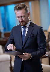 Image showing business man using tablet computer