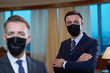 Image showing business team wearing crona virus protection face mask