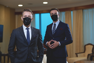 Image showing business team wearing crona virus protection face mask