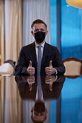 Image showing business man wearing protective face mask at luxury office