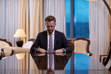 Image showing business man using tablet computer