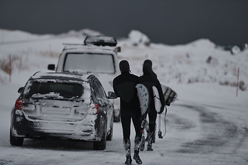 Image showing Arctic surfers in wetsuit after surfing by minivan