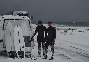 Image showing Arctic surfers in wetsuit after surfing by minivan