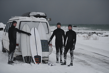 Image showing Arctic surfers in wetsuit after surfing by minivan