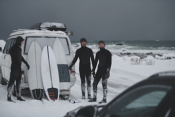 Image showing Arctic surfers in wetsuit after surfing by minivan