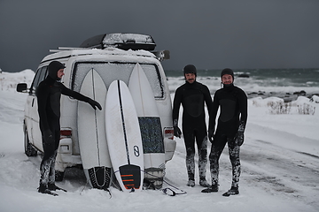 Image showing Arctic surfers in wetsuit after surfing by minivan