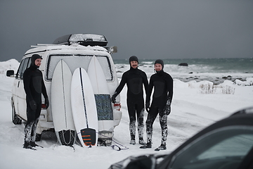 Image showing Arctic surfers in wetsuit after surfing by minivan