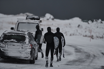 Image showing Arctic surfers in wetsuit after surfing by minivan