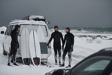 Image showing Arctic surfers in wetsuit after surfing by minivan