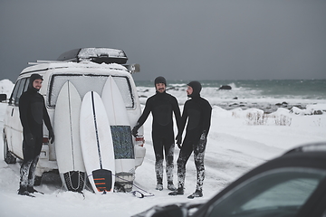 Image showing Arctic surfers in wetsuit after surfing by minivan