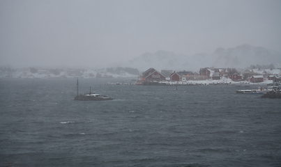 Image showing Traditional Norwegian fisherman\'s cabins and boats