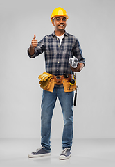 Image showing happy indian builder with blueprint and clipboard