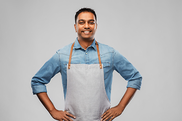 Image showing smiling indian barman, waiter or salesman in apron