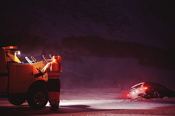 Image showing Car being towed after accident in snow storm