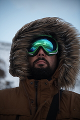 Image showing man at winter in stormy weather wearing warm fur jacket