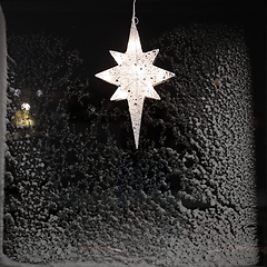 Image showing Star for lightning in the window and decoration during the winter time