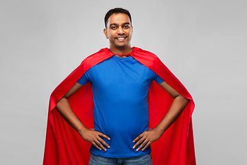 Image showing happy smiling indian man in red superhero cape