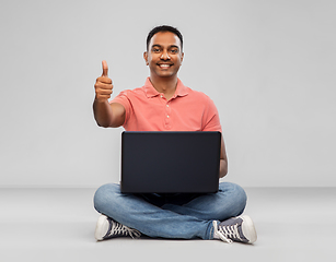 Image showing happy indian man with laptop showing thumbs up