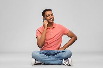 Image showing happy indian man calling on smartphone