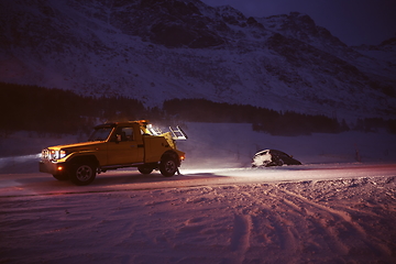 Image showing Car being towed after accident in snow storm