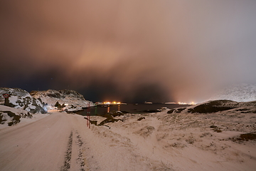 Image showing Aurora borealis Green northern lights above mountains