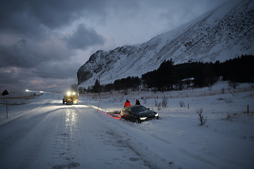 Image showing Car being towed after accident in snow storm