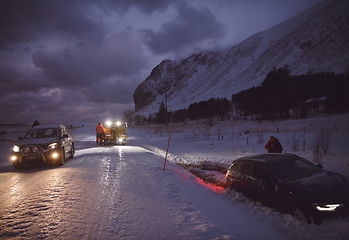 Image showing Car being towed after accident in snow storm