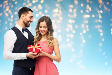 Image showing happy couple with gift on valentines day