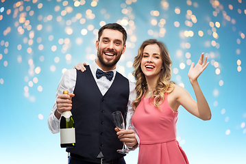 Image showing happy couple with bottle of champagne and glasses