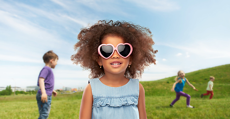 Image showing little african girl in sunglasses at summer