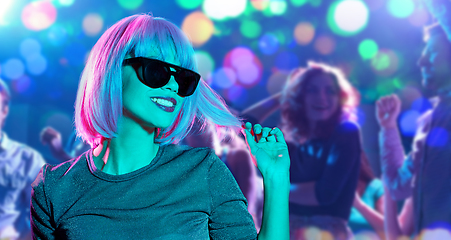 Image showing happy woman in pink wig and black sunglasses