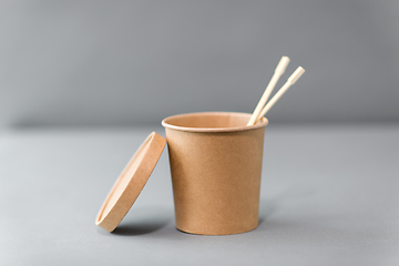 Image showing paper container for takeaway food with chopsticks