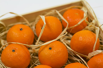 Image showing tangerines with straw