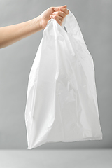 Image showing woman holding white disposable plastic bag