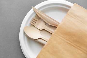 Image showing wooden spoon, fork and knife on paper plate